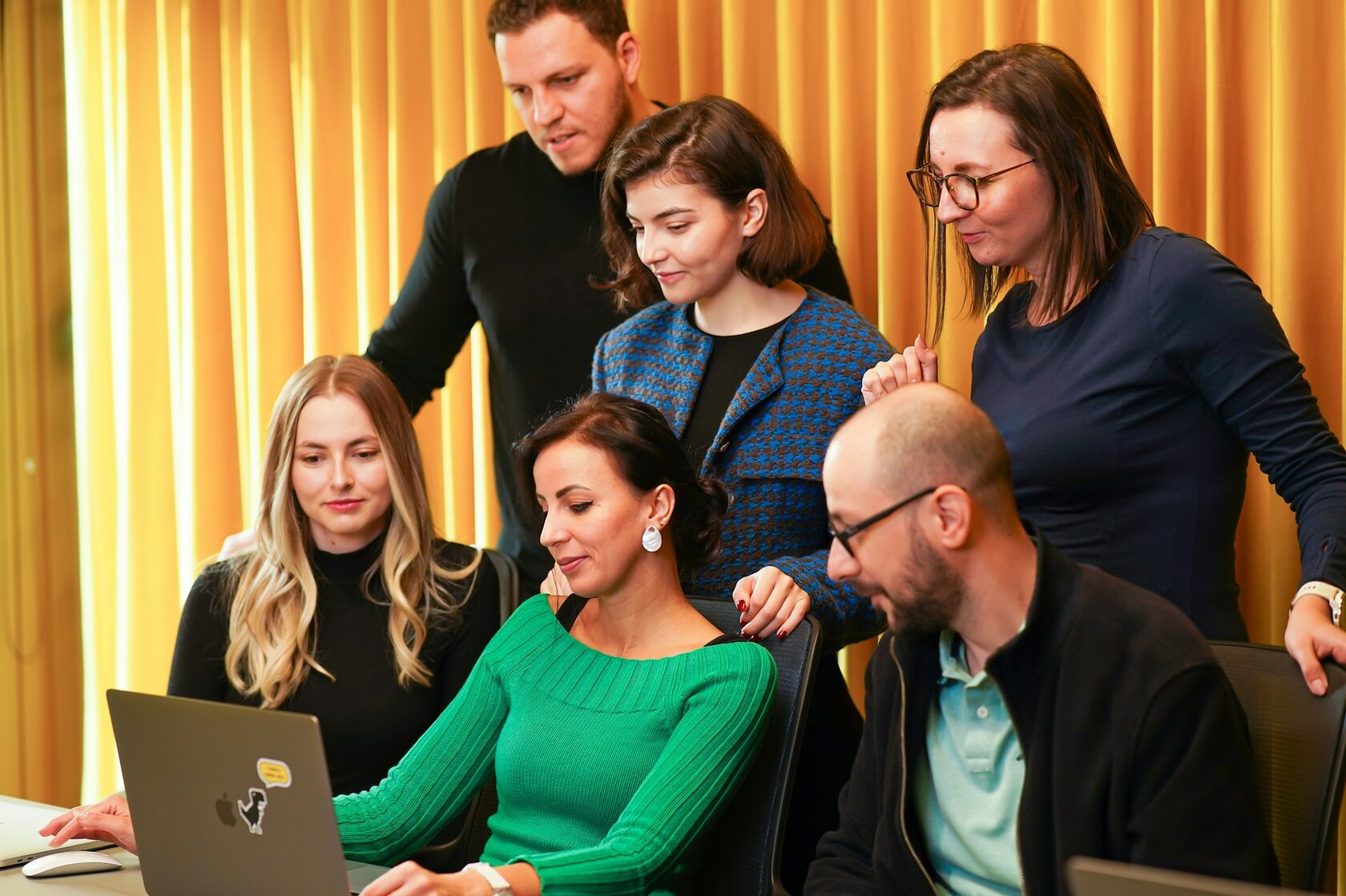 Team celebrating brand launch of Klikko in an agency office