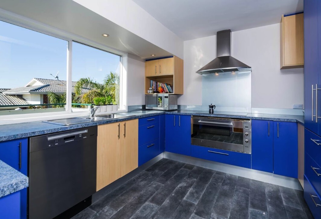 Before: original Glenfield kitchen with blue and timber cabinetry