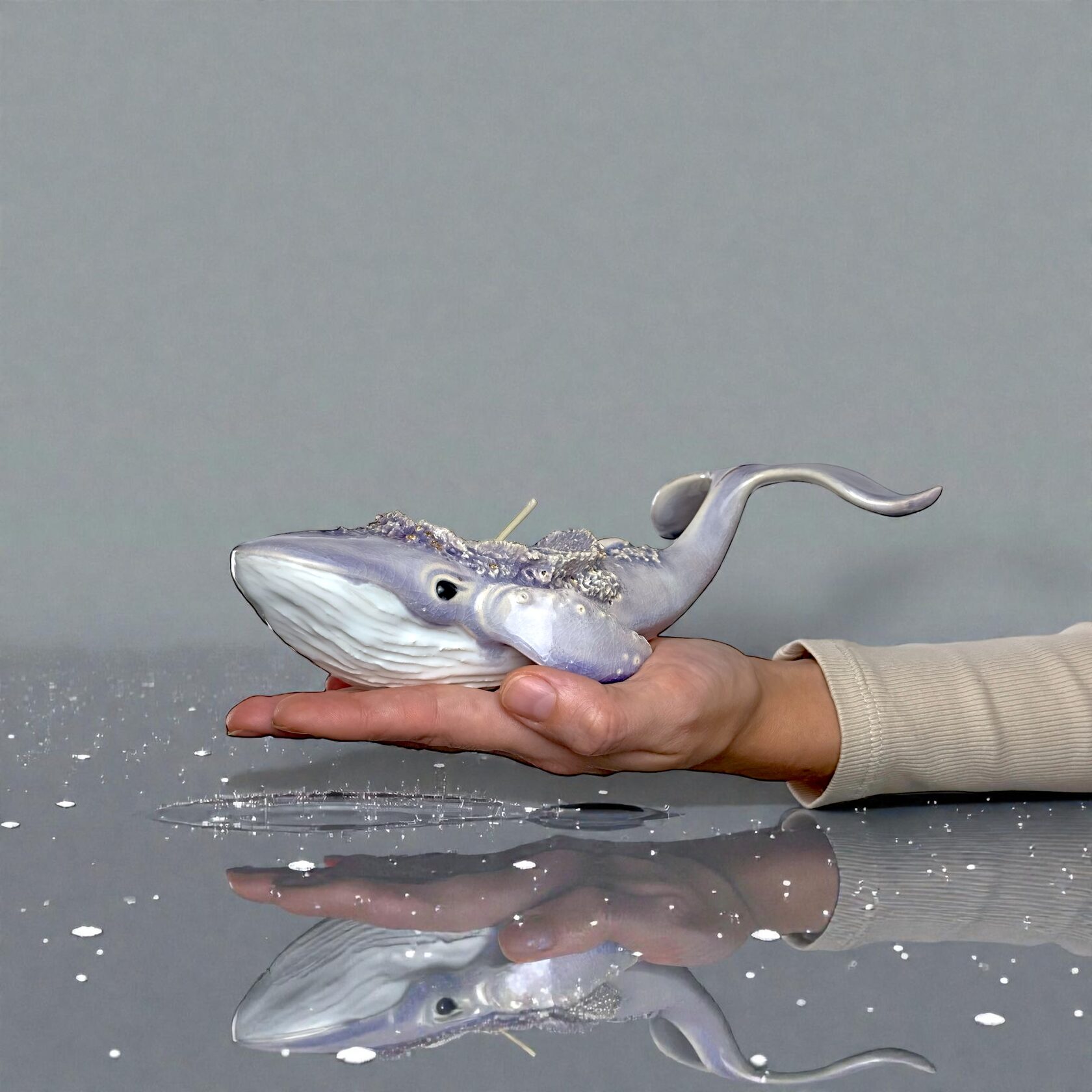Handmade lavender ceramic whale candle holder with textured back