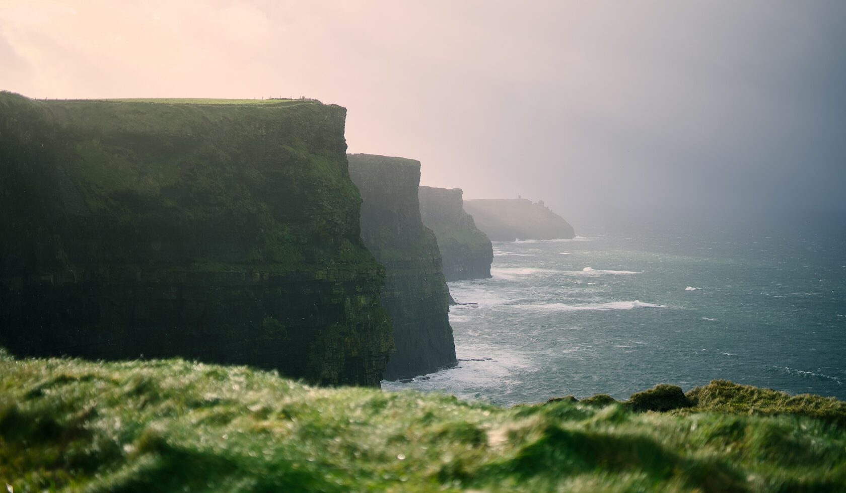 Green coastal road along the cliffs of Ireland