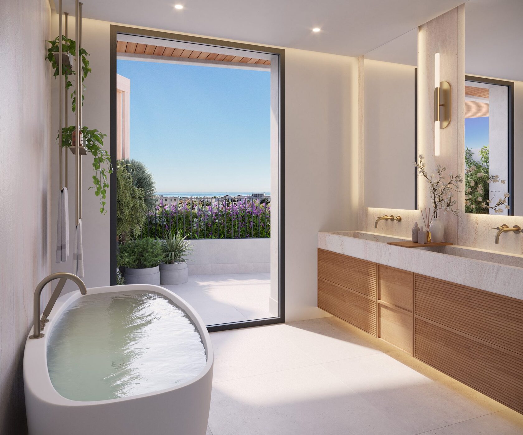 Master bathroom with a freestanding bath and sea view