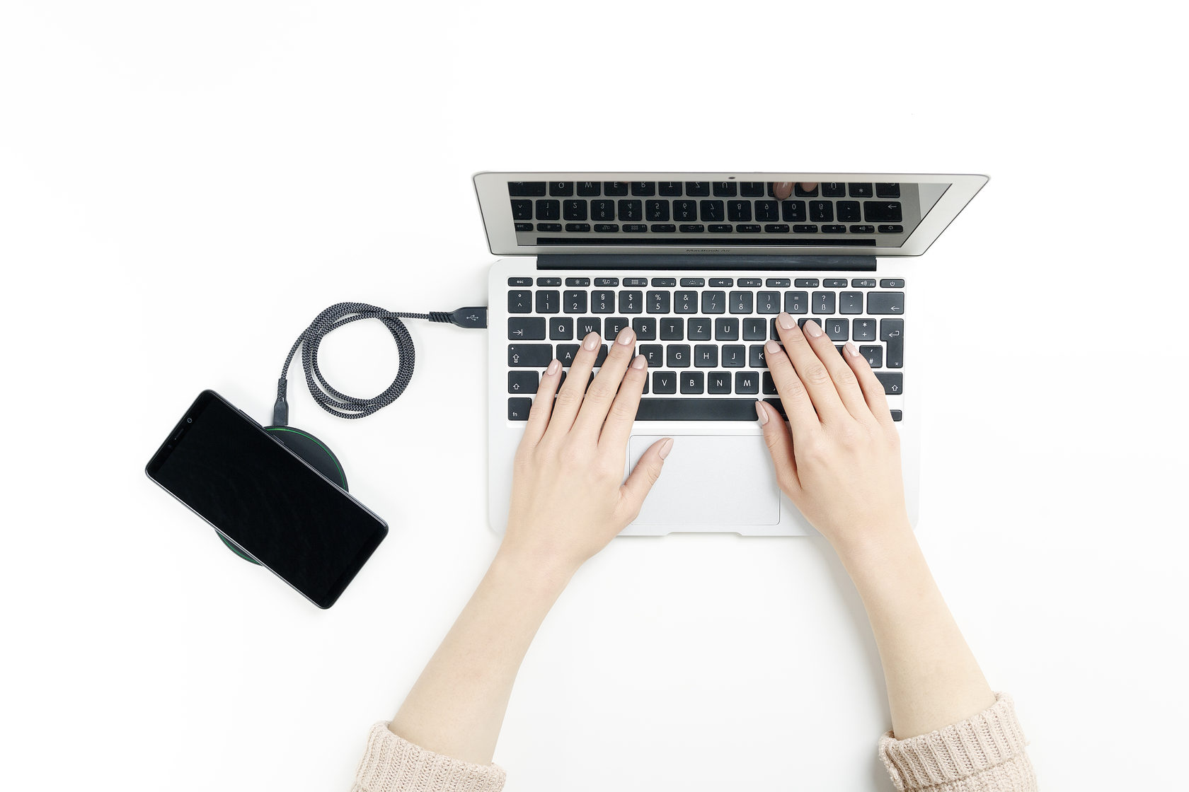 Thin wireless charger connected to a laptop