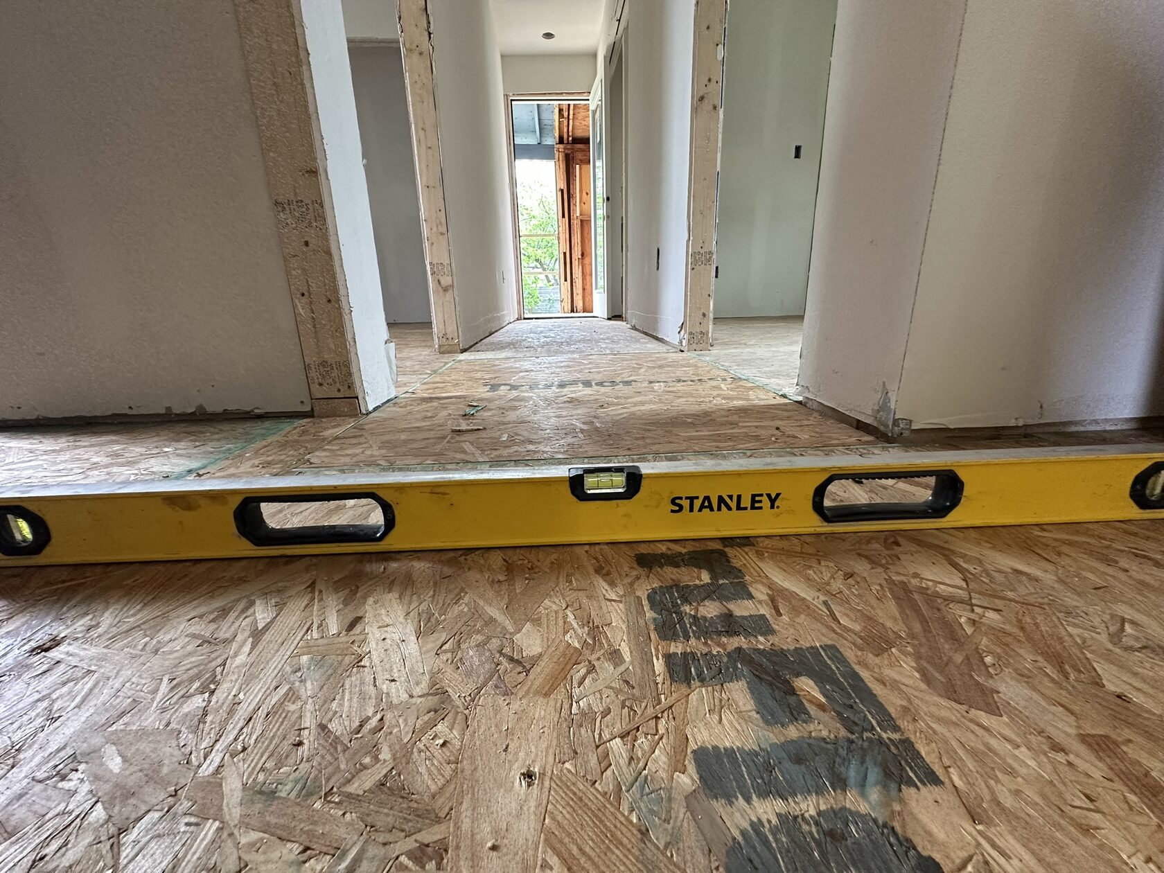 OSB subfloor · Preparation before the finish flooring — Austin house flip by Kir Remodeling