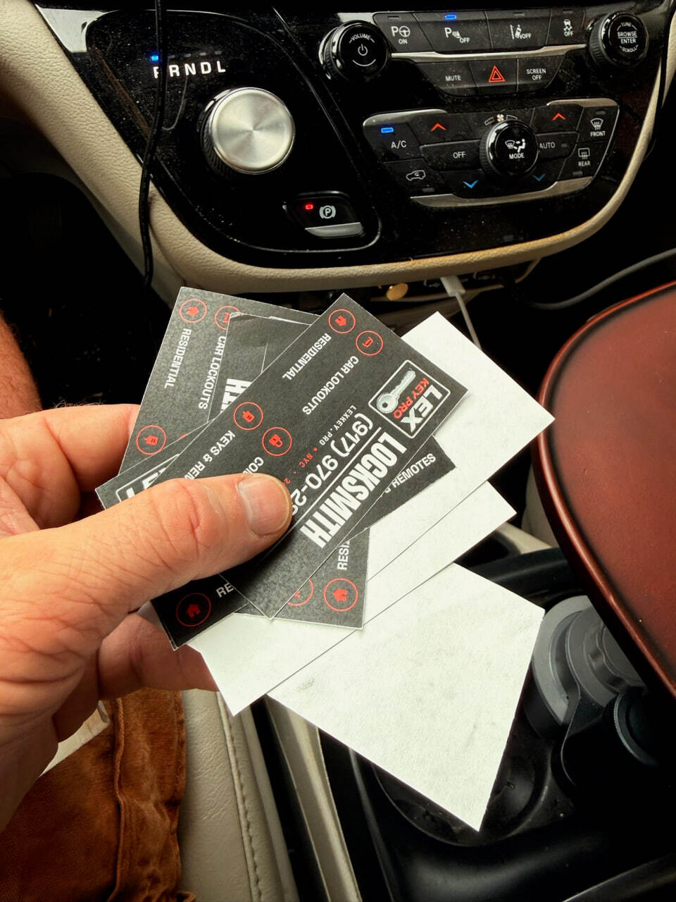 LexKey Locksmith LLC car lockout service cards inside a vehicle