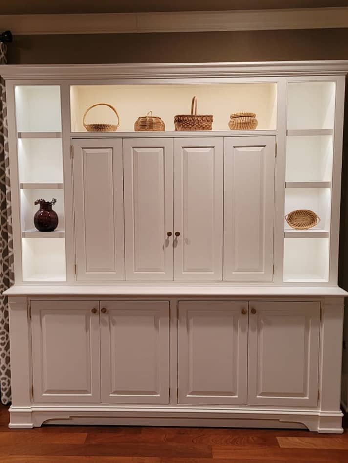Classic entertainment and display cabinet with concealed TV and lighted shelves