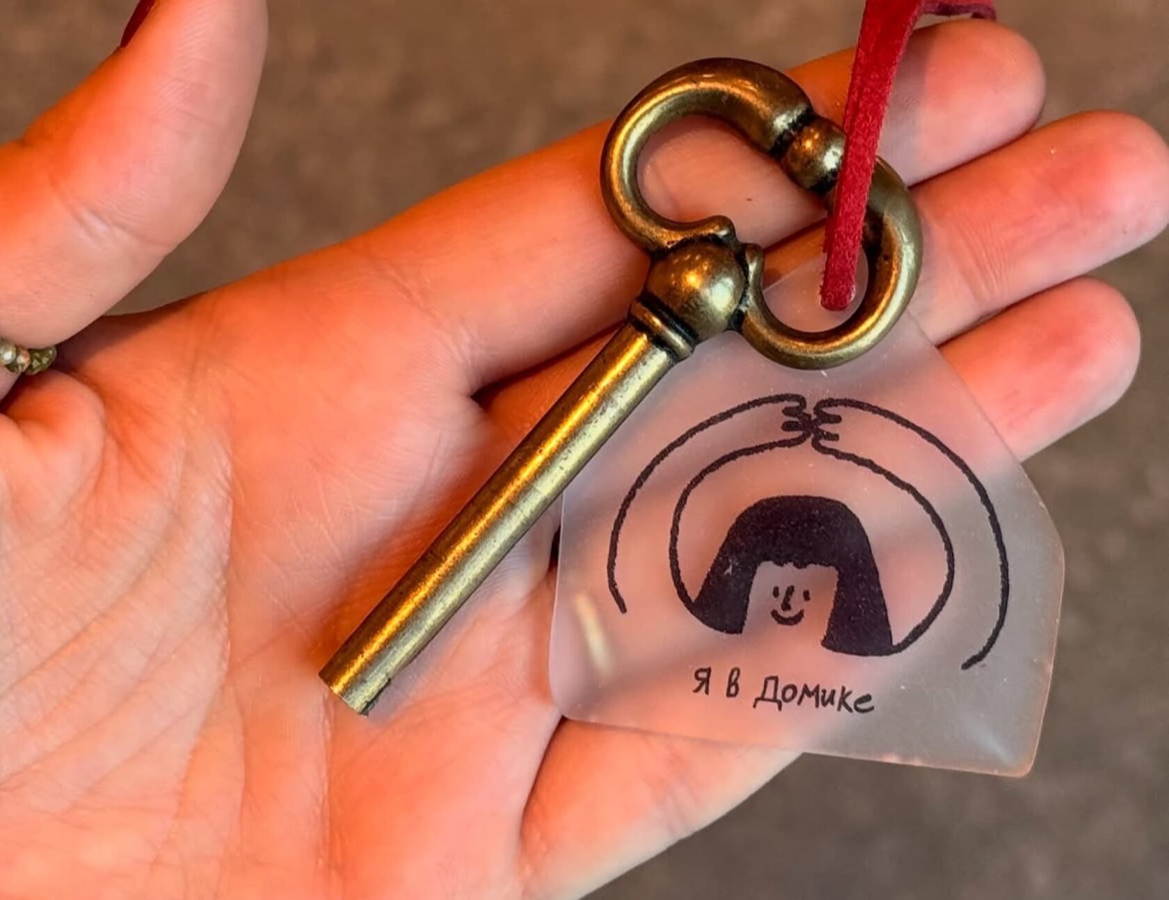 Gift certificate keychain in hand