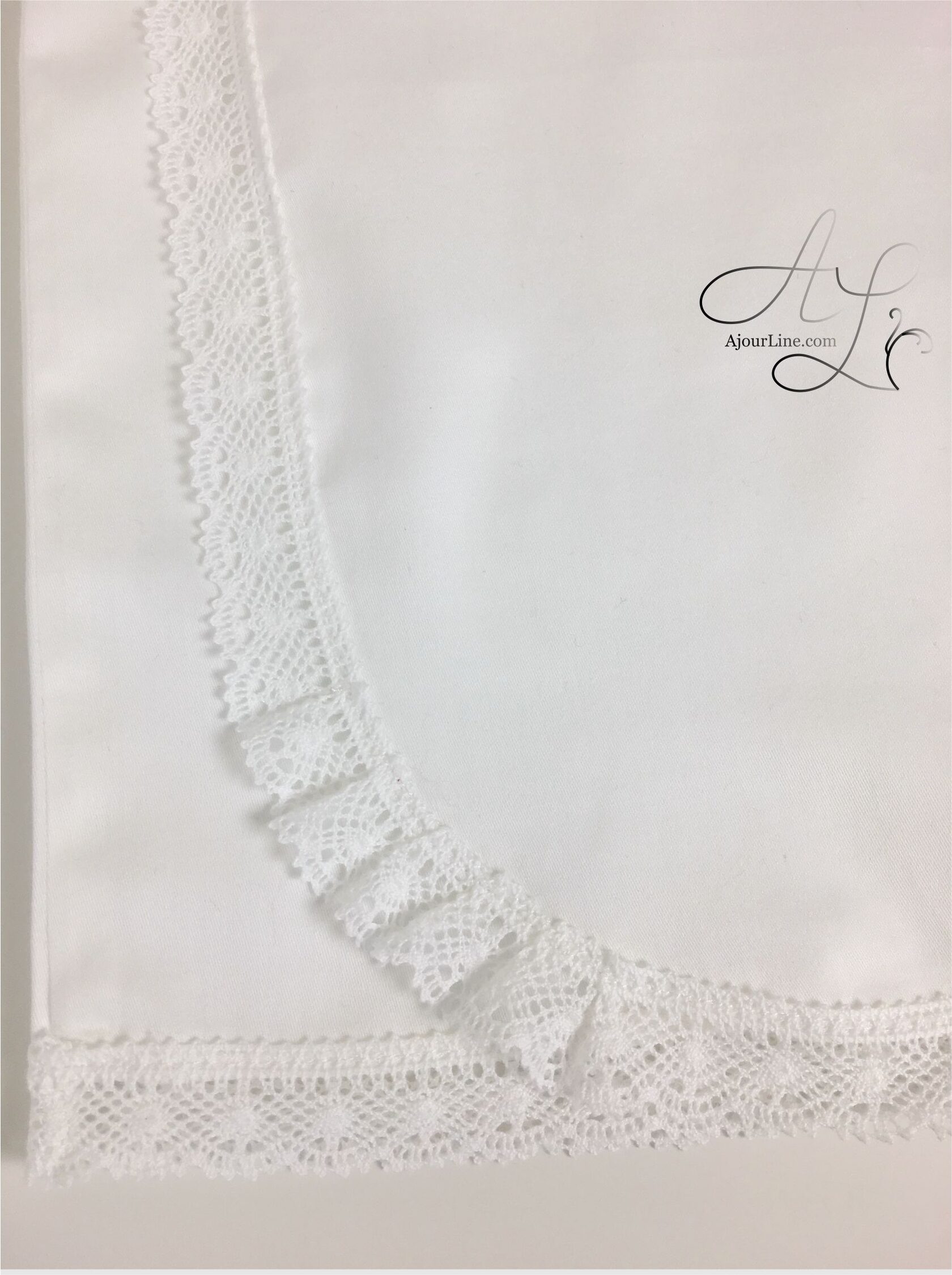 Wrap-style christening shirt for babies up to one year, made from soft natural fabric with embroidery, made to order in Riga, worldwide shipping.