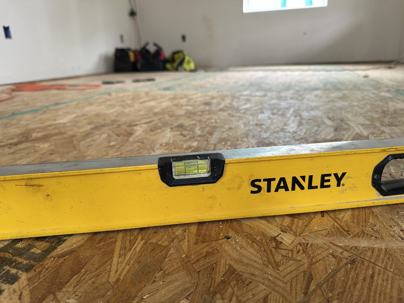 Subfloor preparation · Reviewing the surface — Austin house flip by Kir Remodeling