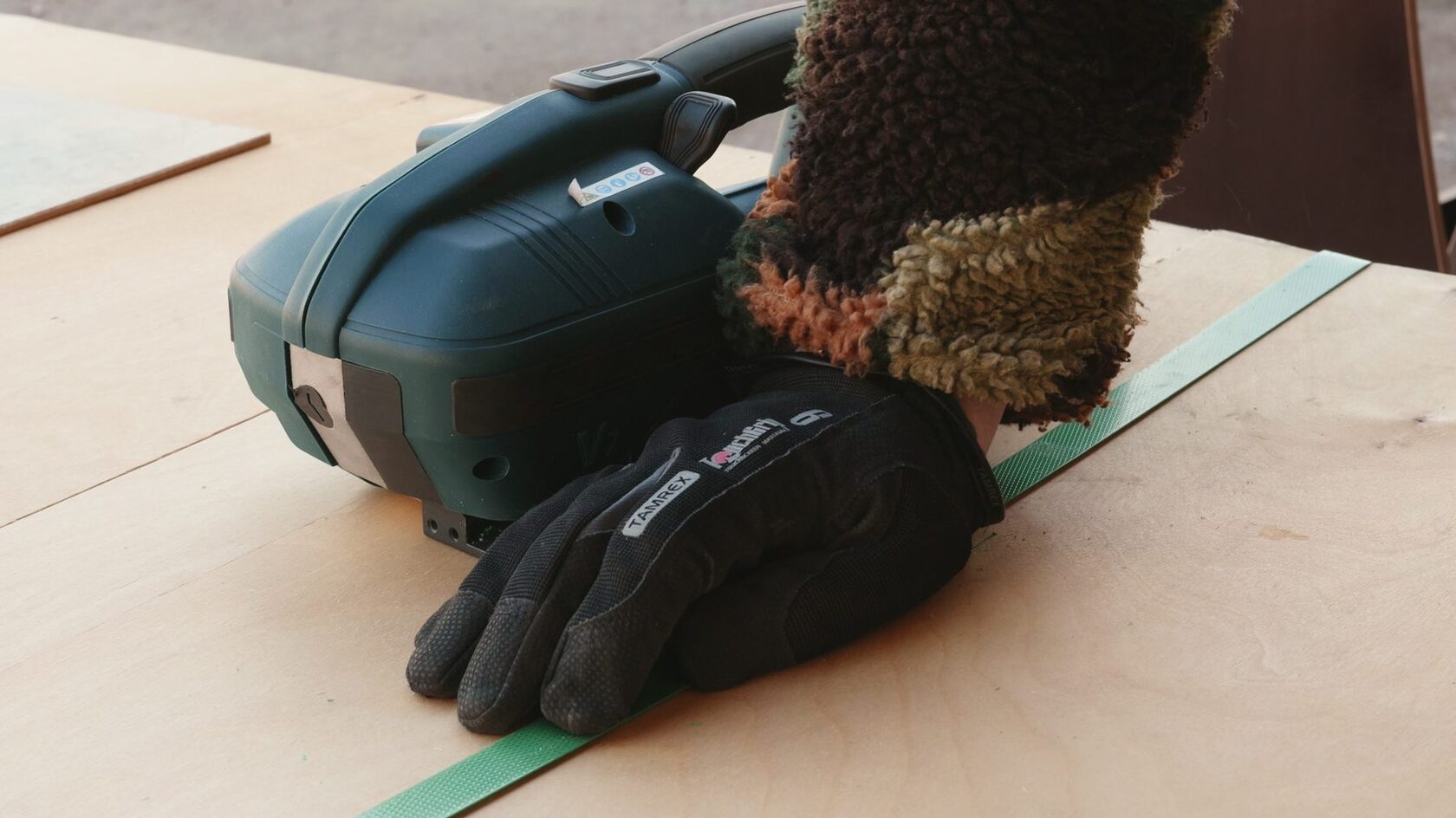 Strapping a crate in the workshop before dispatch