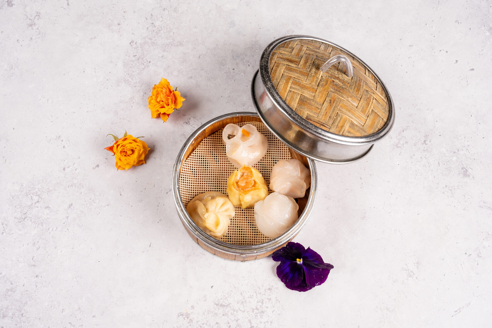 Restaurant food photography with dim sum on a pale background