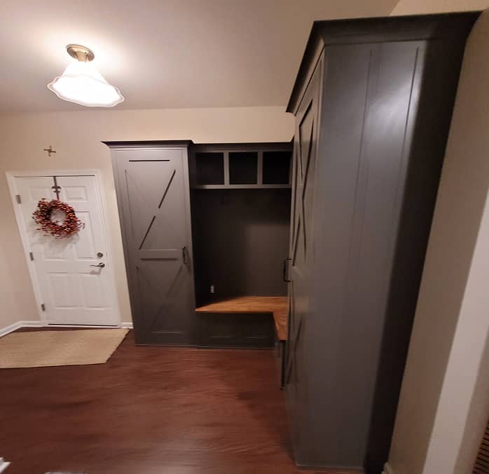 3/4 view of Farm house style mudroom cabinets with built-in bench in dark grey color