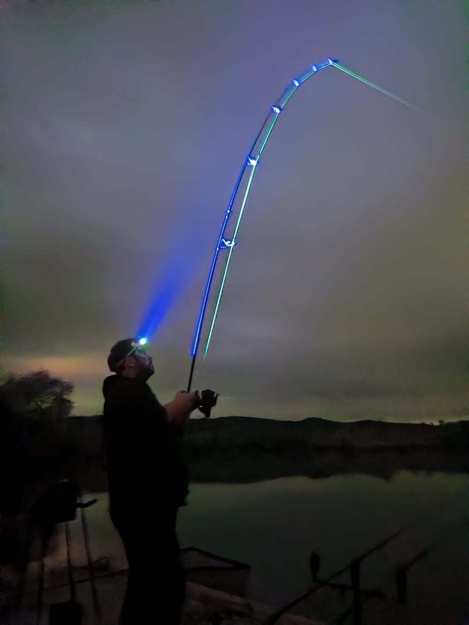 Angler using the Katran W/B 460 PRO headlamp