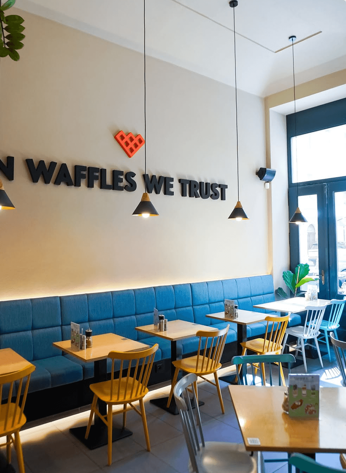 Coffee & Waffles café interior with neon logo