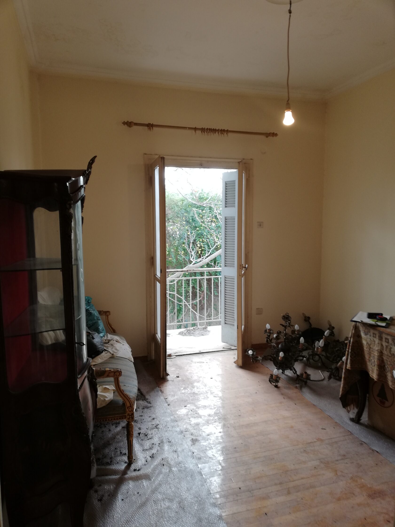 Study before renovation, dark wood, painted-over skylight