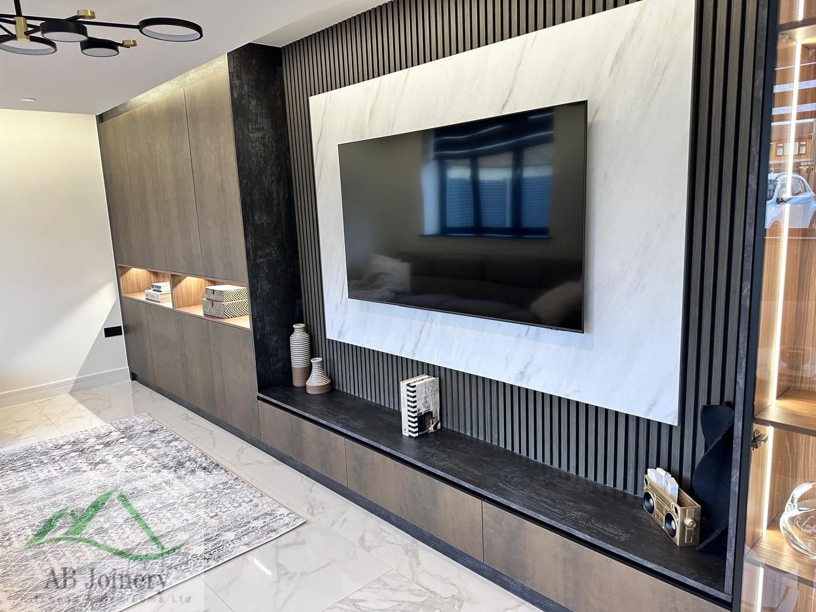 Media wall with storage drawers and shelving