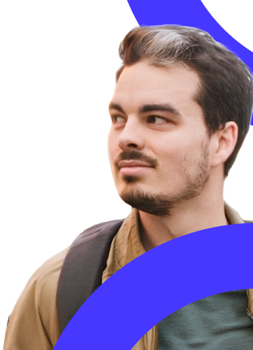 A man (Kasper Tim Hansen) in a brown t-shirt and carrying a backpack looking to the left.