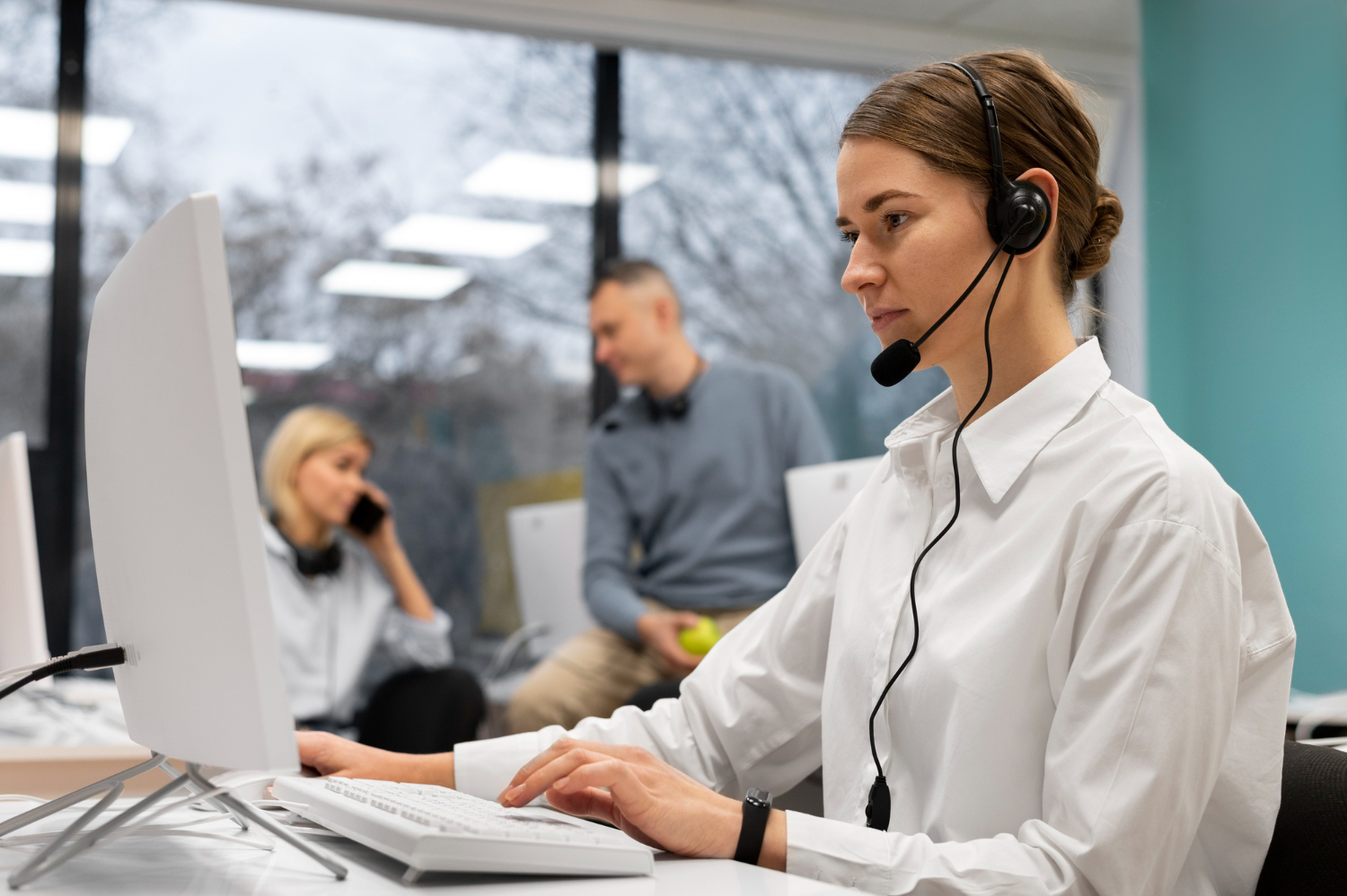 A Luxe Skies travel manager taking calls