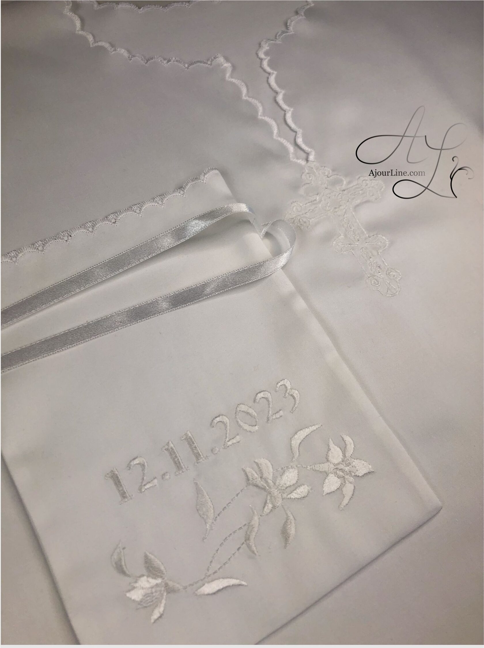 Christening set made from soft natural fabric, including a christening shirt and a hair lock pouch with embroidery, made to order in Riga, worldwide shipping.