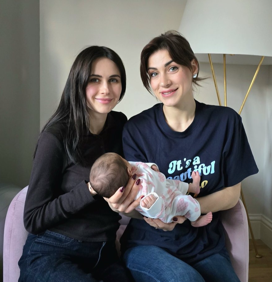 Valentina with a client and her baby
