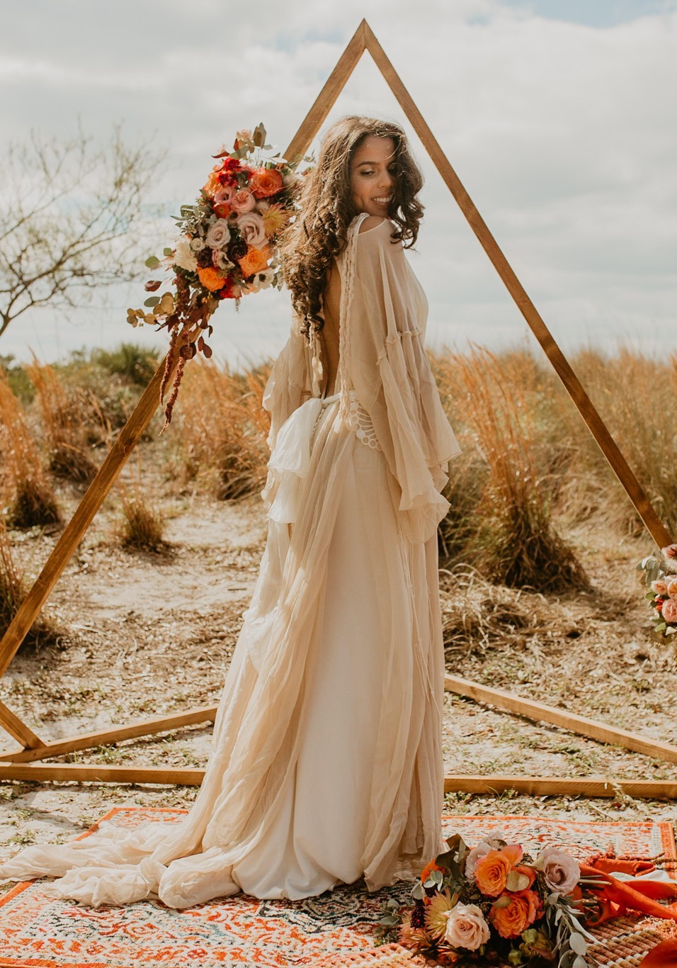 Photo of a bride with flowers by Honey Peony