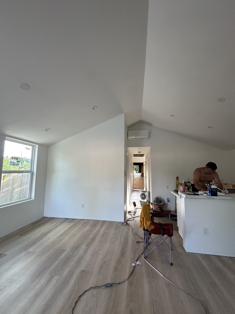 Interior renovation · LVP and kitchen work stage — Austin house flip by Kir Remodeling