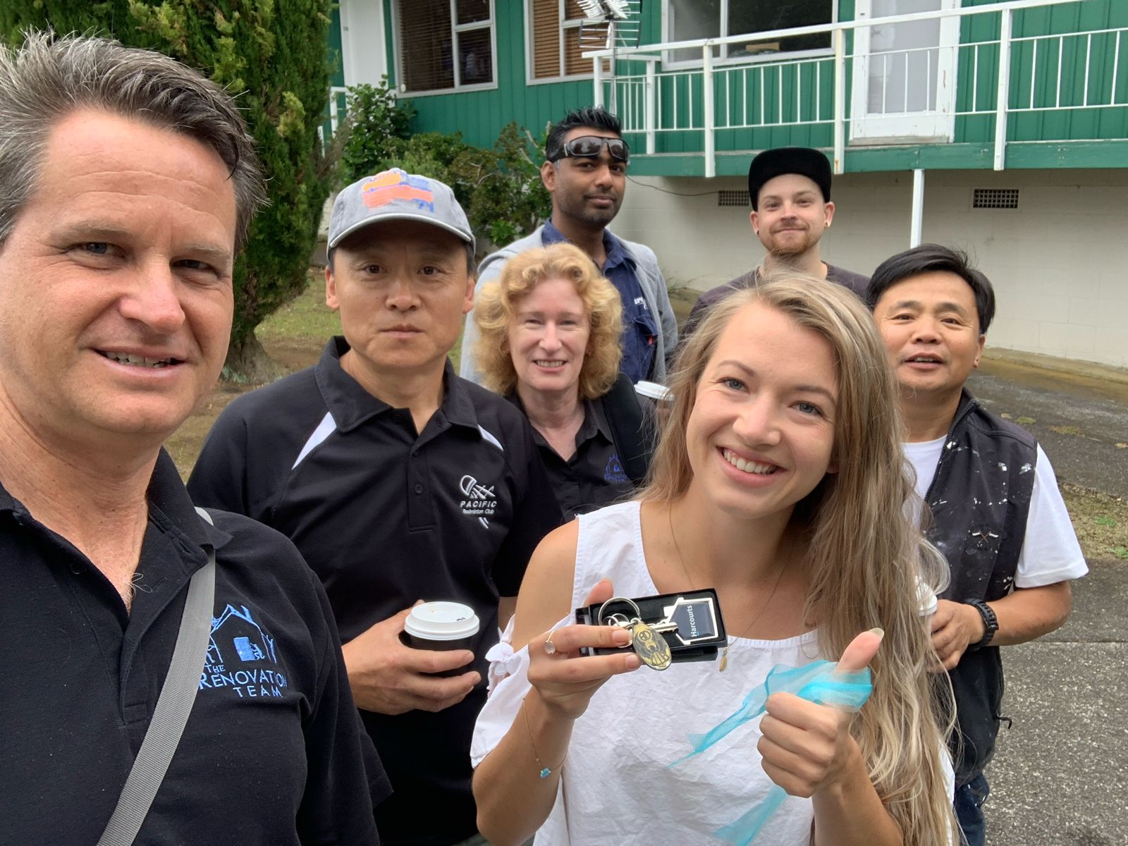 Maria holding the keys to her renovated first home with The Renovation Team in Mount Eden, Auckland