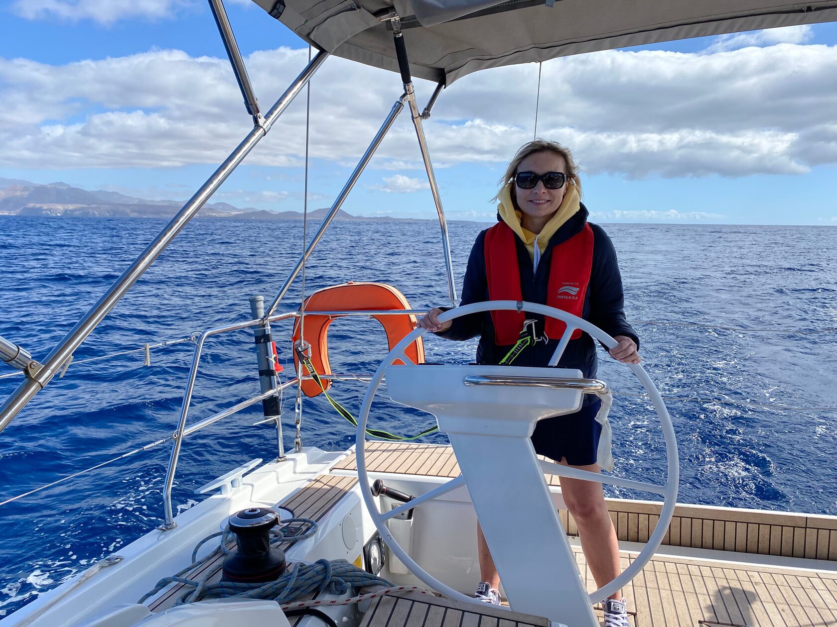 Guest steering the yacht