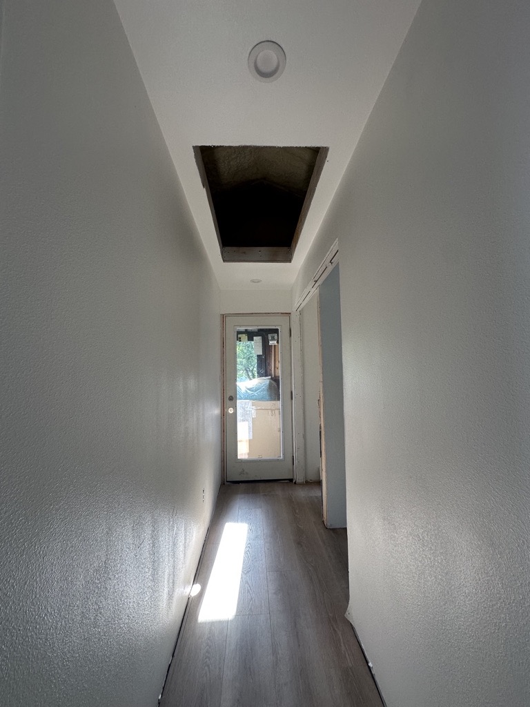 Hallway painting · Work in progress — Austin house flip by Kir Remodeling