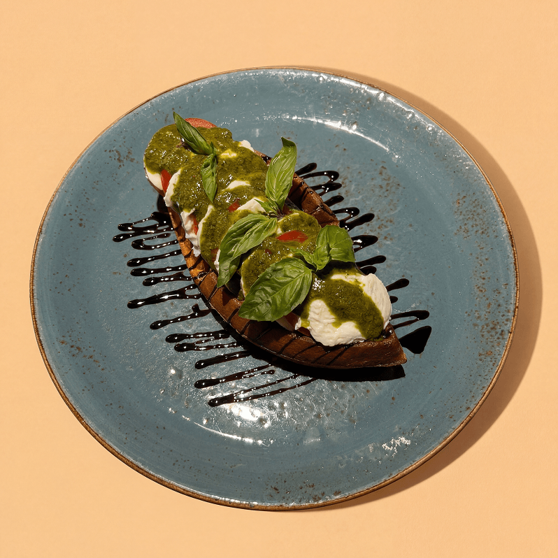 Caprese waffle with mozzarella, tomatoes, pesto and balsamic