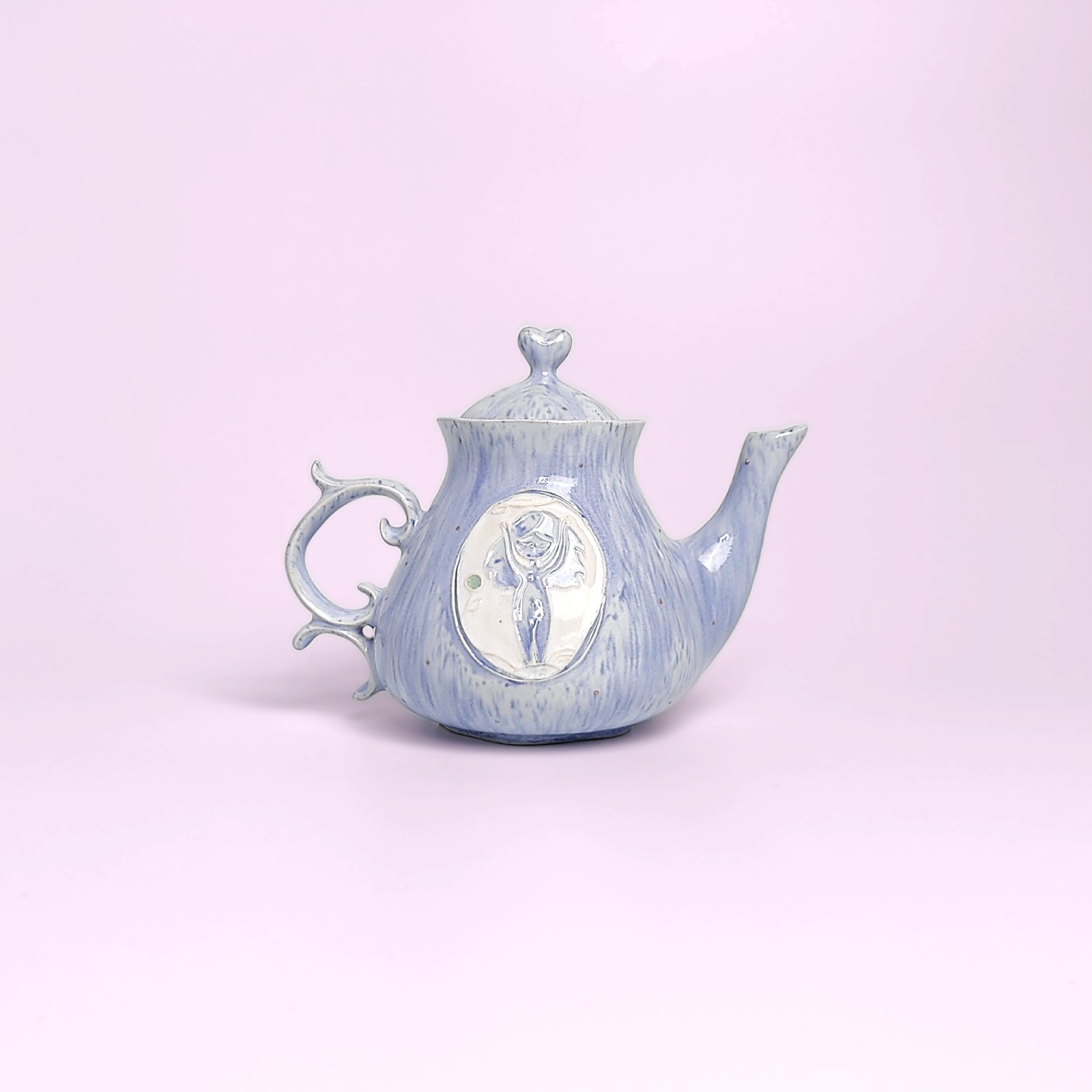 whimsical handmade ceramic tea set in soft blue glaze with forest fairy medallions — an elegant, one-of-a-kind creation