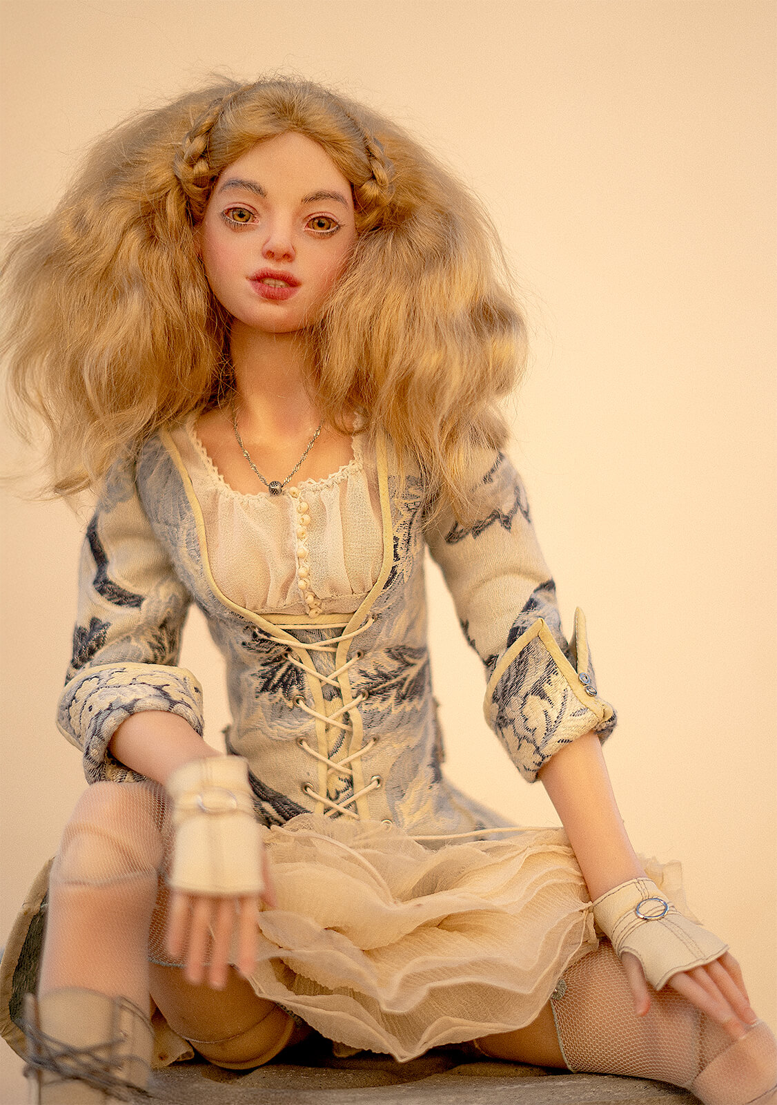 Posable art doll sitting”