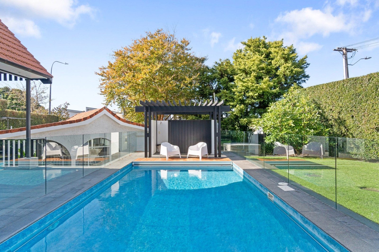 Renovated Epsom swimming pool, landscaped garden and clear glass balustrade
