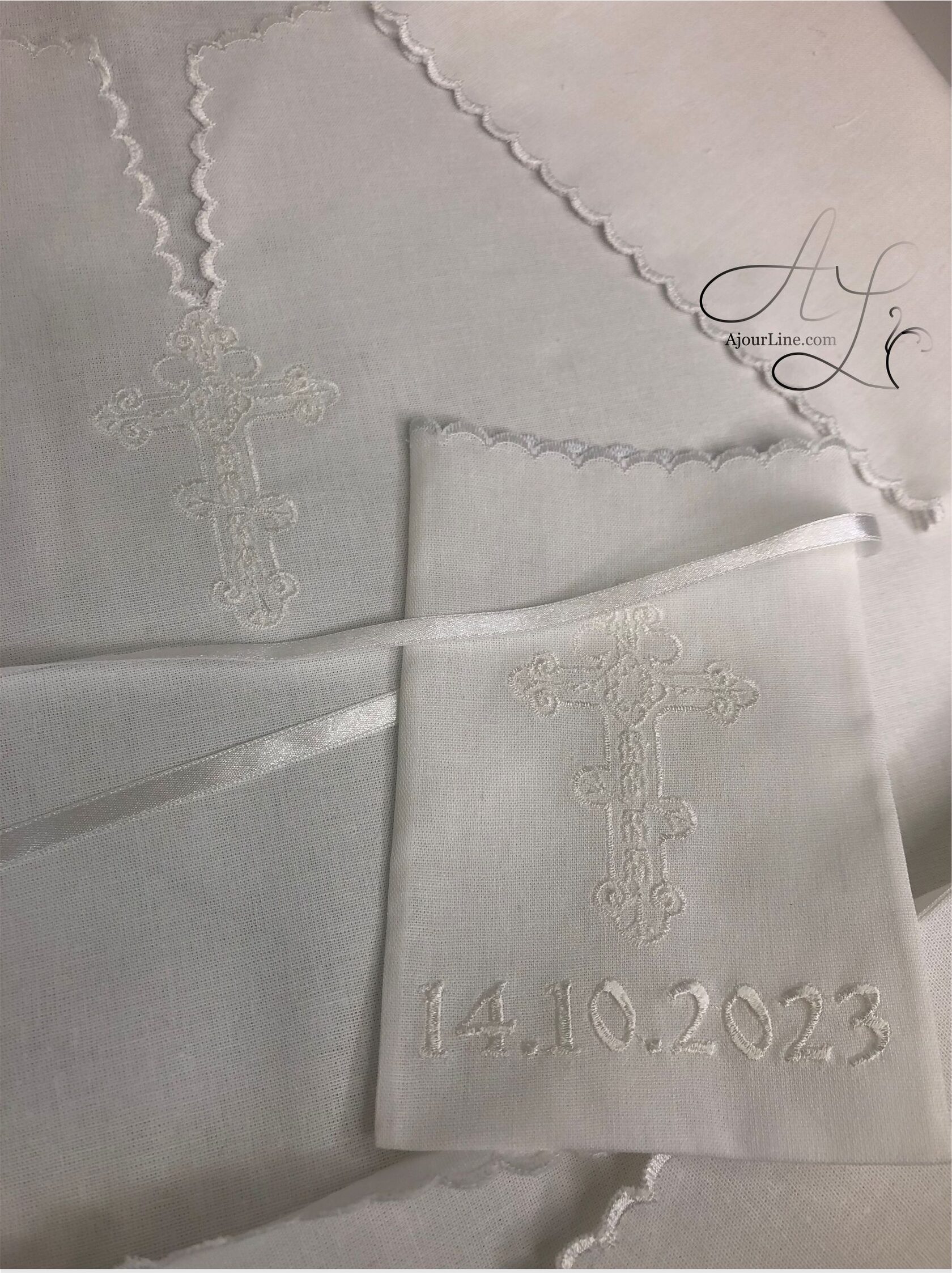 Christening set made from soft natural fabric, including a christening shirt and a hair lock pouch with embroidery, made to order in Riga, worldwide shipping.