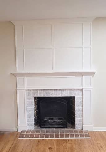 Craftsman fireplace with over mantel paneling 
