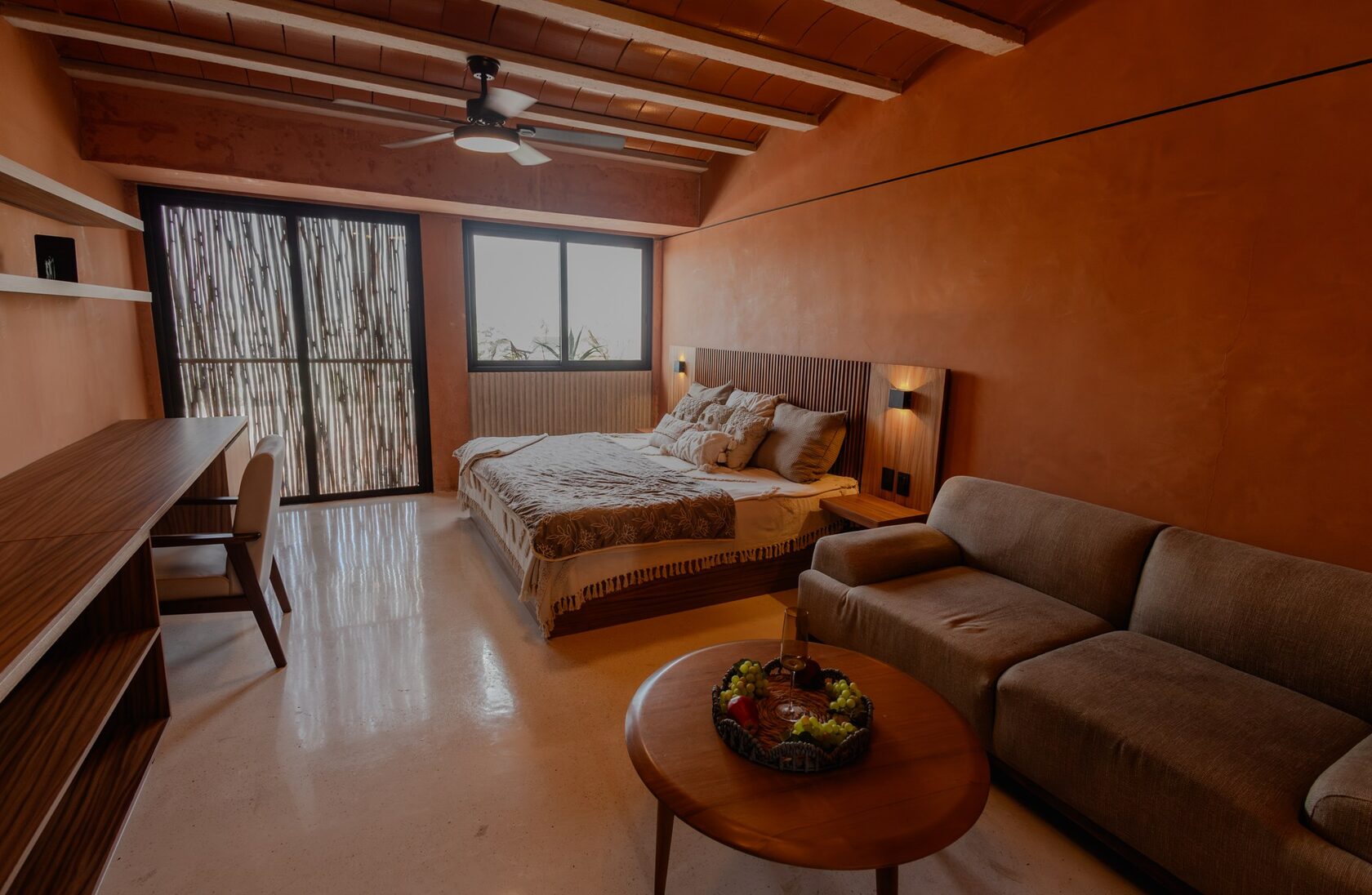 Kabax studio with warm wood finishes and terracotta-toned walls