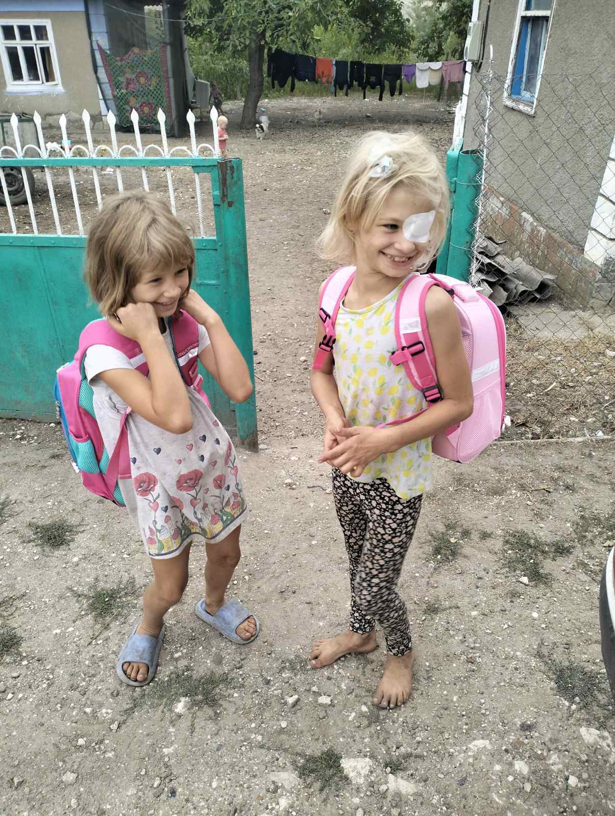 Children receiving backpacks
