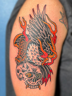 Traditional eagle and skull tattoo