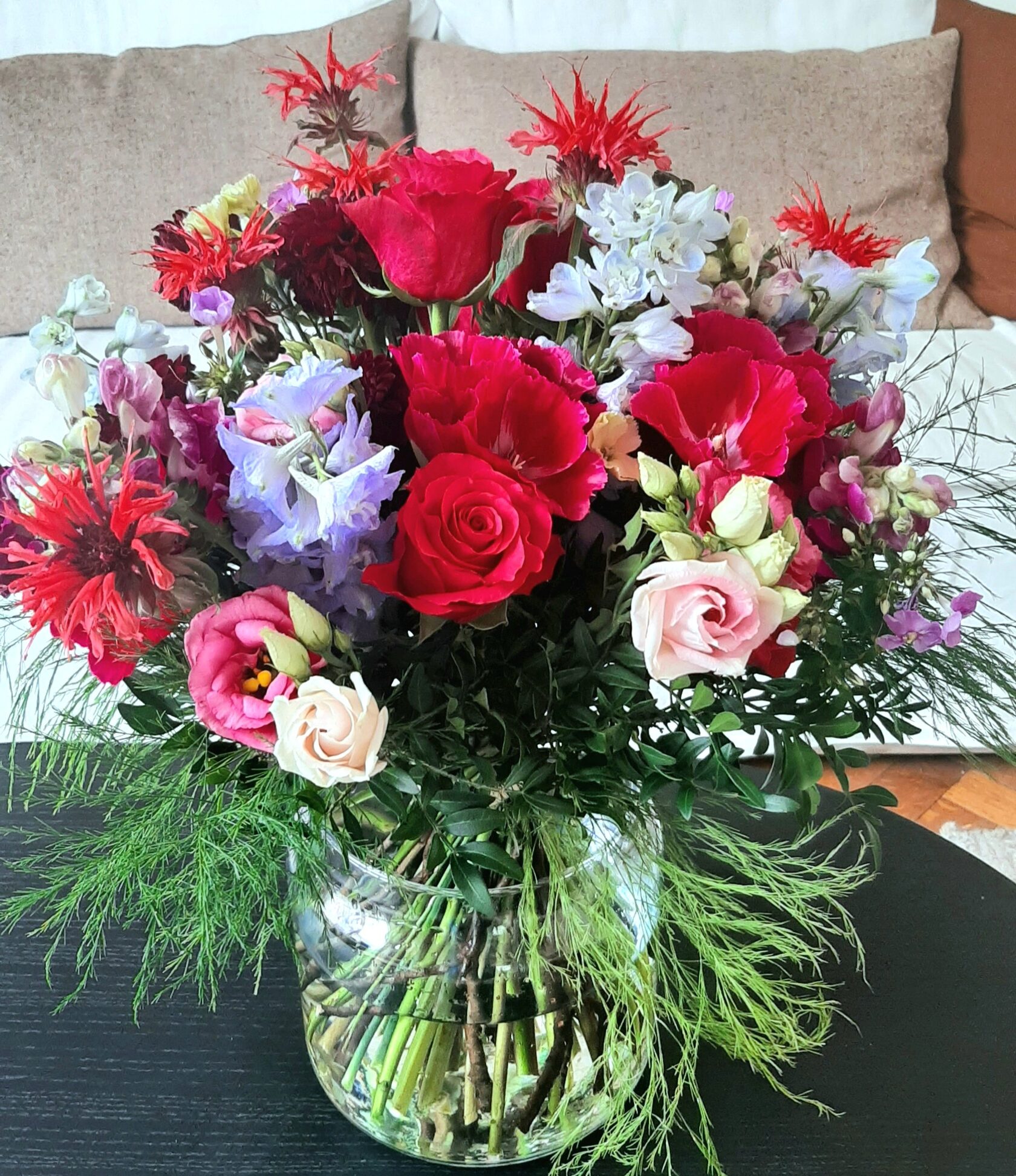 vibrant floral arrangement with roses and exotic flowers