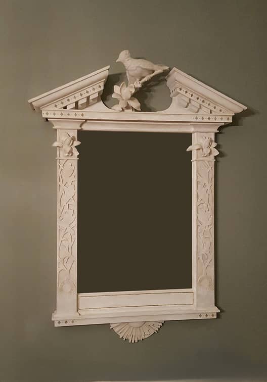 Large carved wood colonial style mirror frame with intricate classical detailing