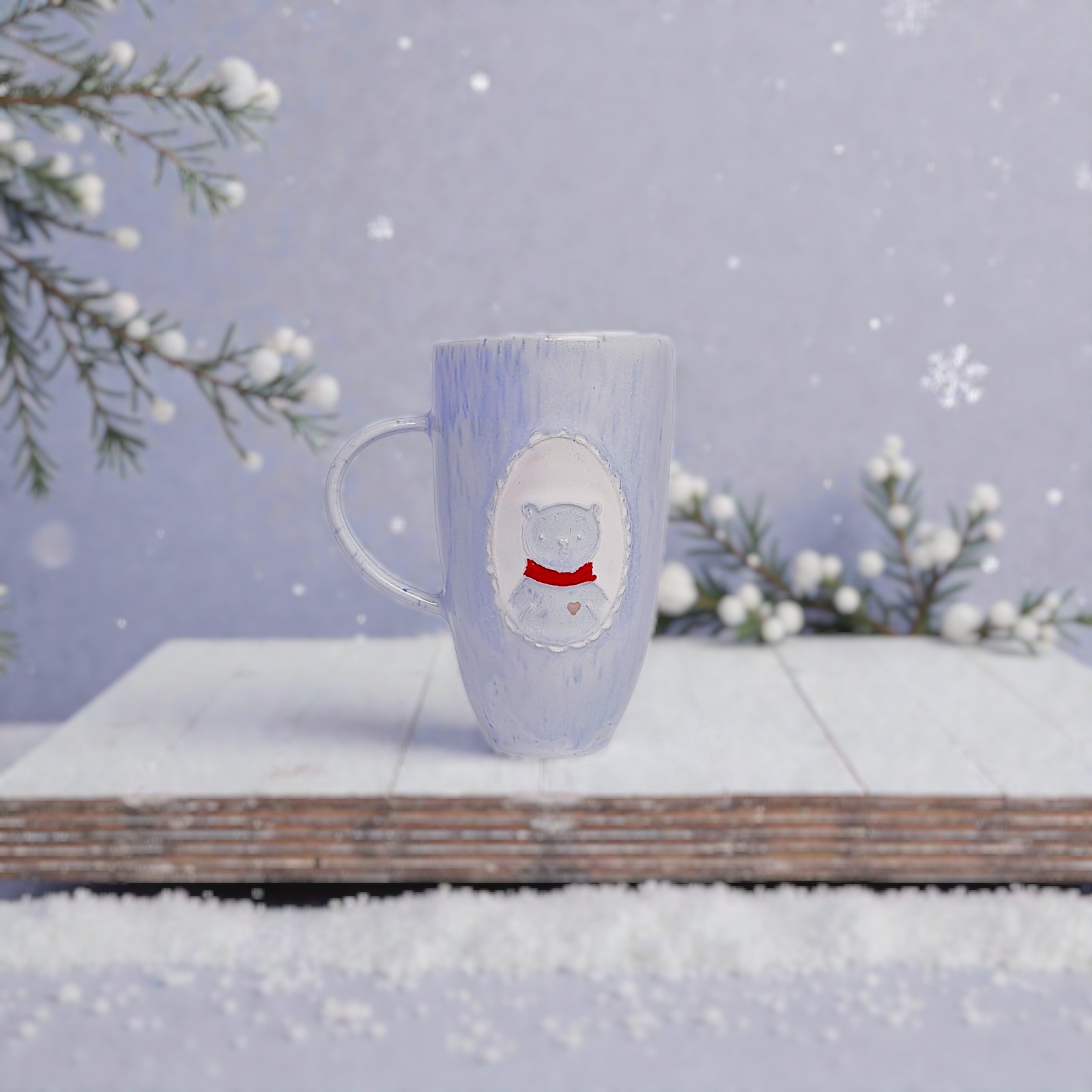 Handmade ceramic mug with bear in red scarf, winter design, artist pottery with snow and pine branches