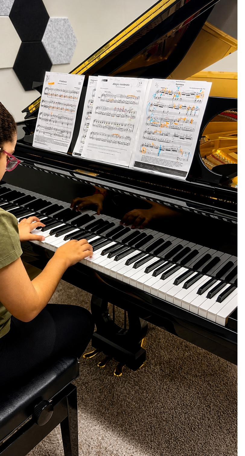 Child learning piano