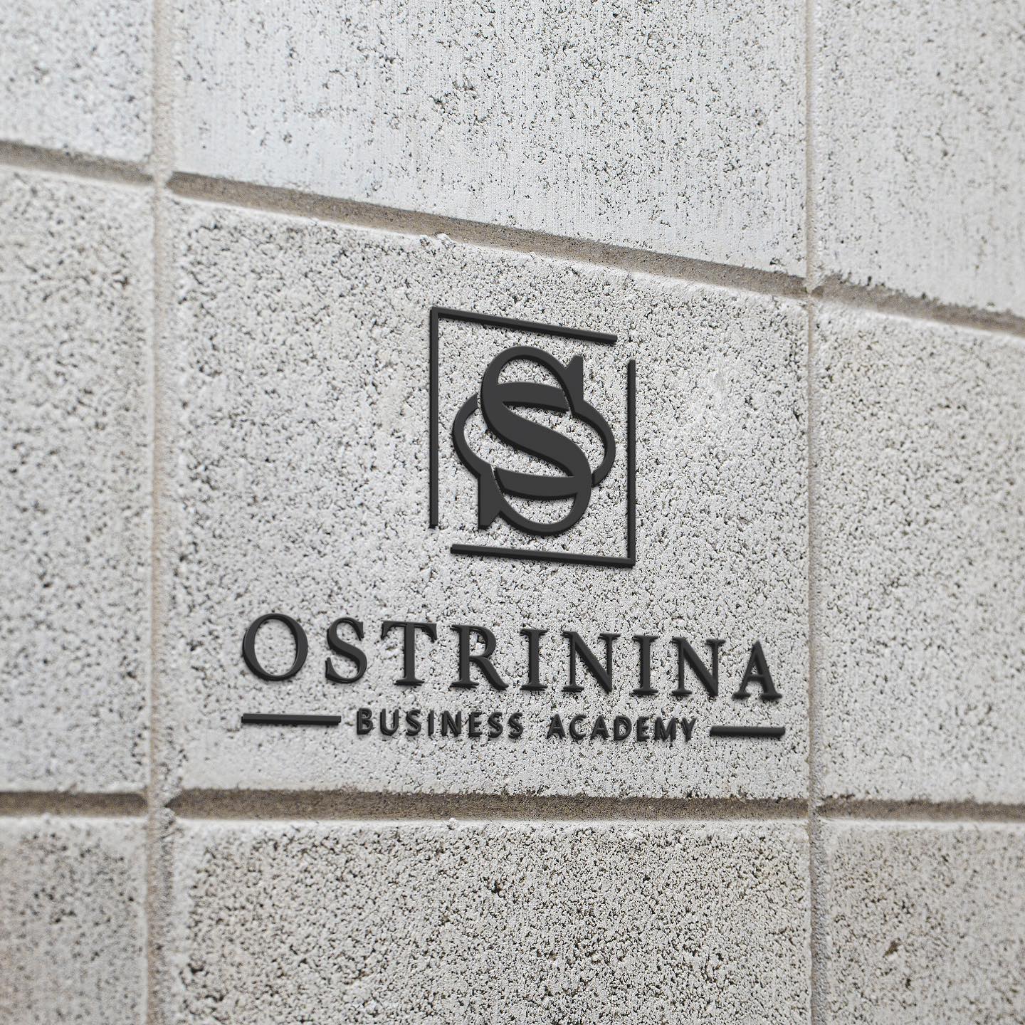Ostrinina logo on a brick wall