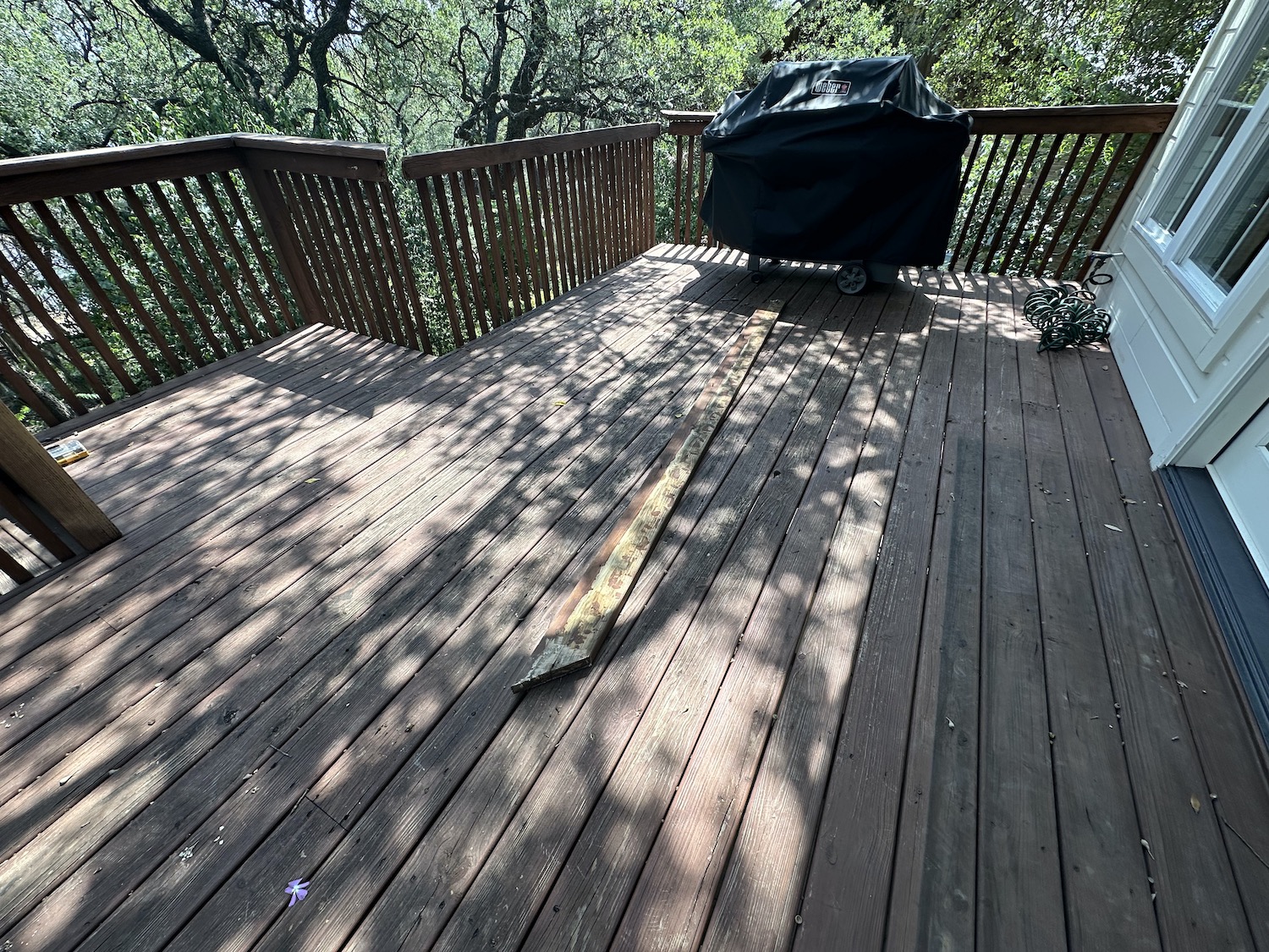 Deck before restoration in Austin TX — rotted support post and failed weathered paint surface