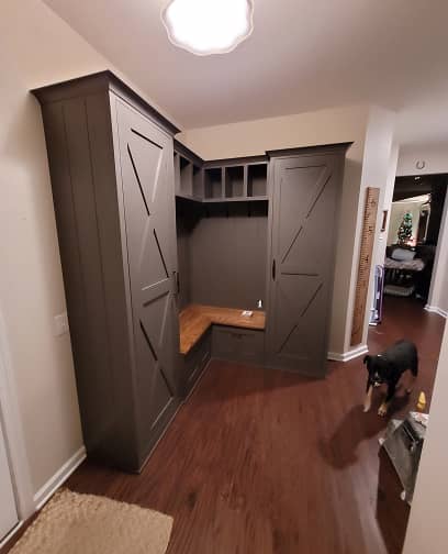 3/4 view of Farm house style mudroom cabinets with built-in bench in dark grey color