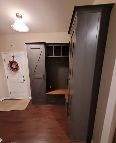 3/4 view of Farm house style mudroom cabinets with built-in bench in dark grey color