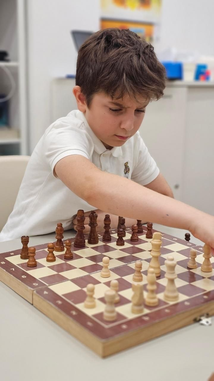 Children learning chess at the introduction level