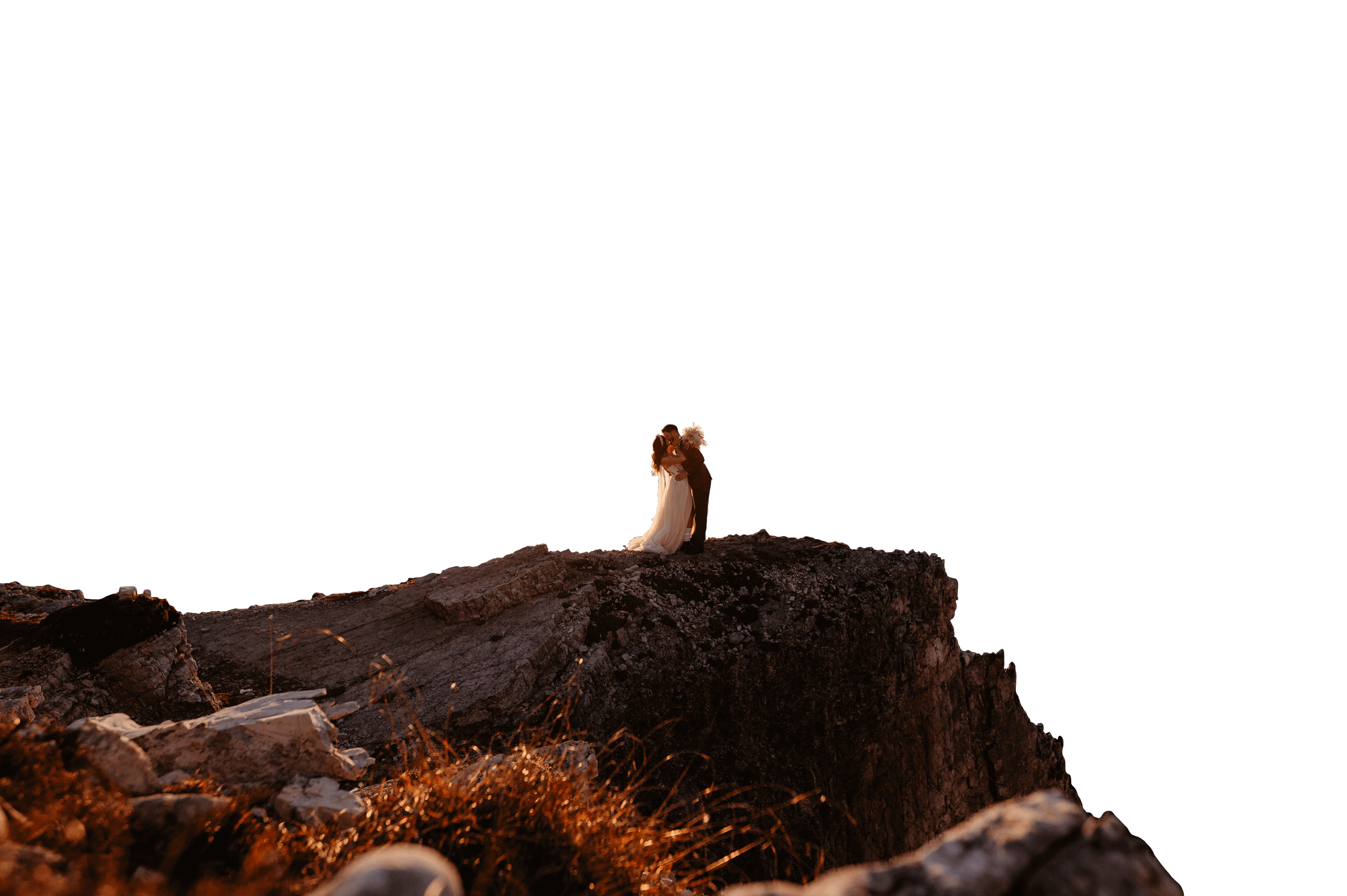 Couple embracing on a misty mountain summit at sunrise — authentic mountain elopement photography in European Alps