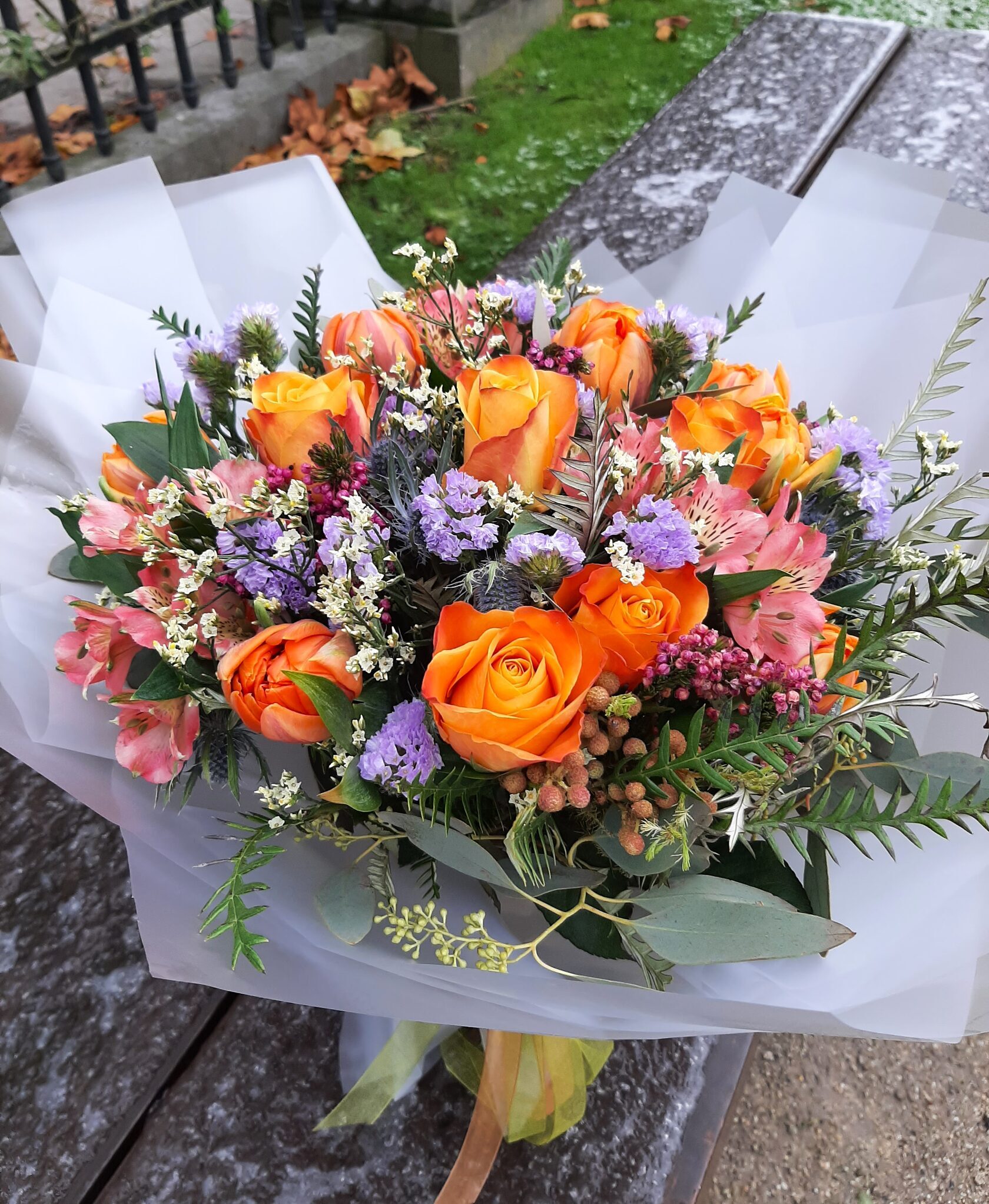 a vibrant bouquet in orange and purple shades