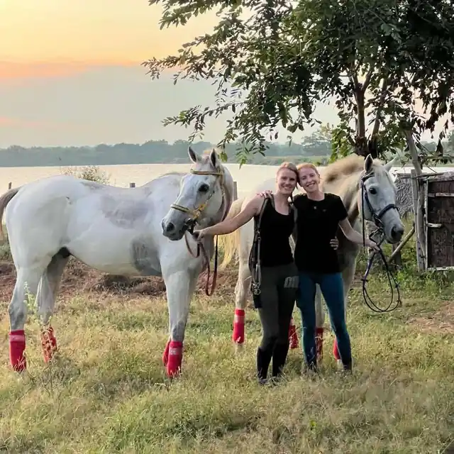 Guests standing with horses after riding at Vonfidel Ranch in Sri Lanka