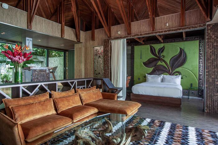 Honeymoon Grand Pool Villa interior with vaulted wood ceiling
